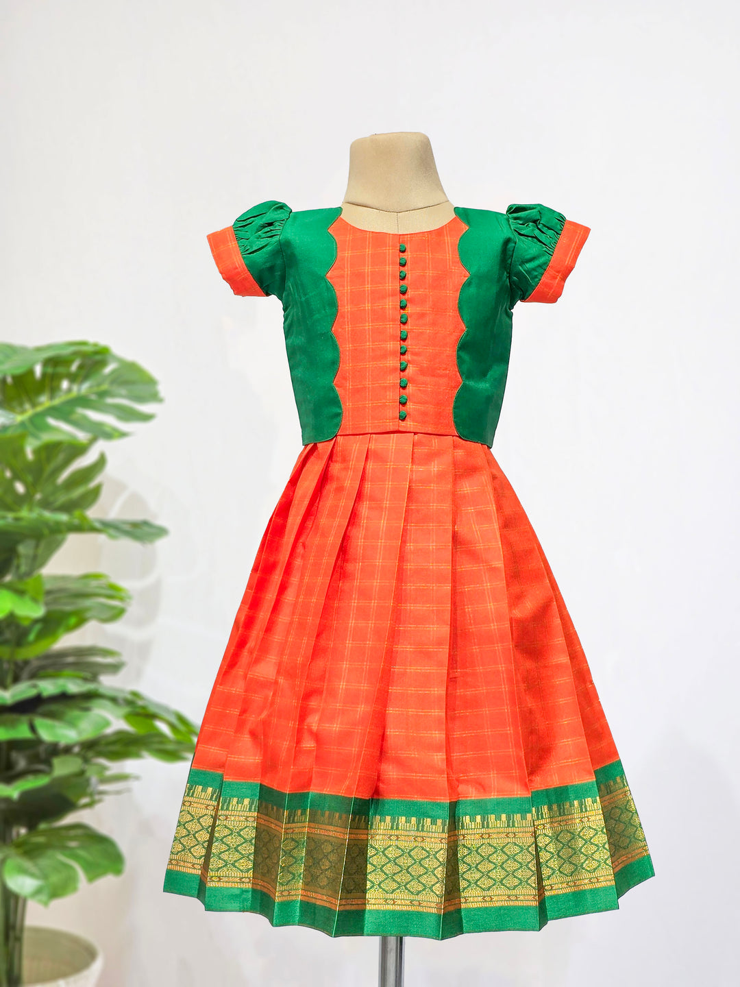 Karthika - Orange Green Pattu Pavadai Minipattu